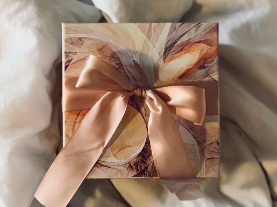 white and brown floral paper on white textile
