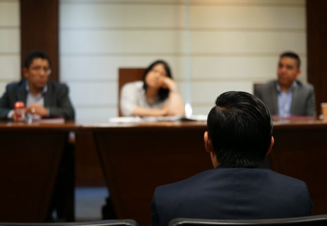 man in black shirt sitting beside woman in white shirt