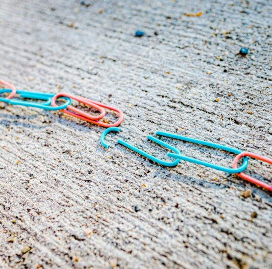 blue green and red plastic clothes pin